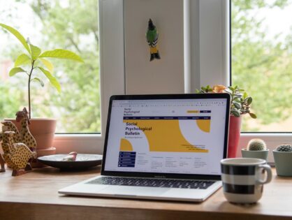 laptop showing website with yellow theme design