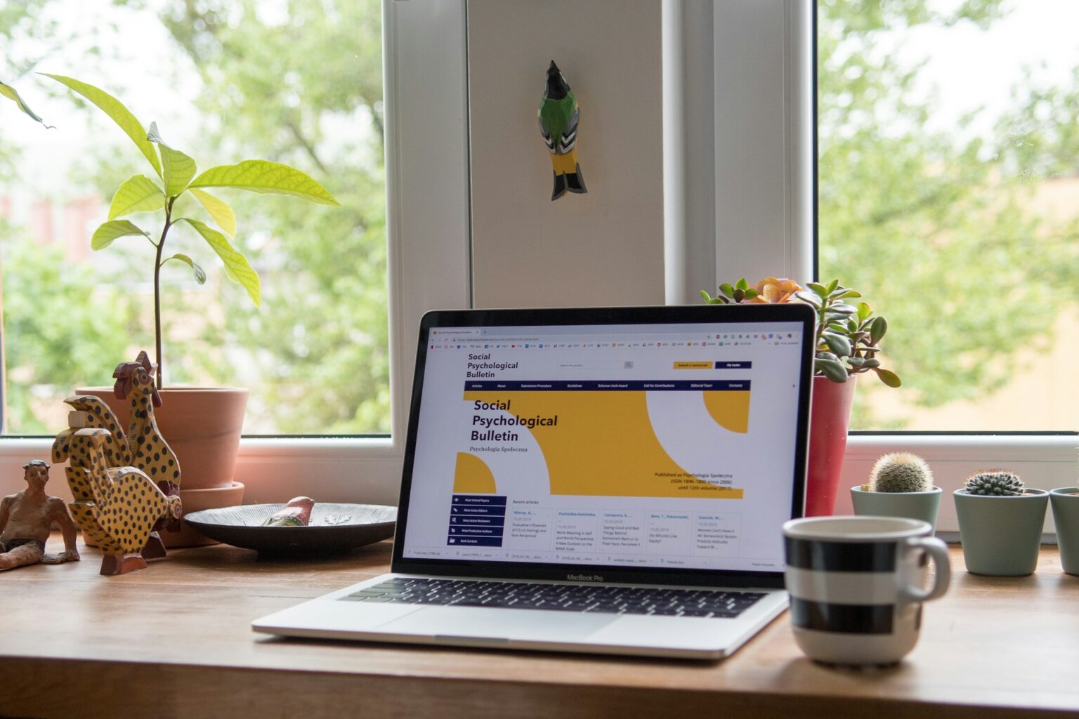 laptop showing website with yellow theme design