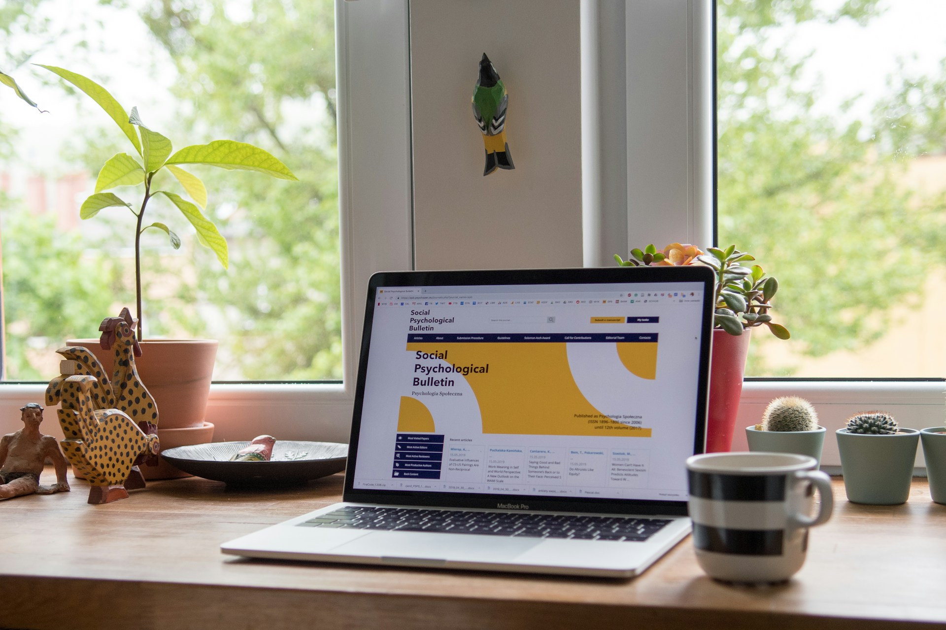 laptop showing website with yellow theme design